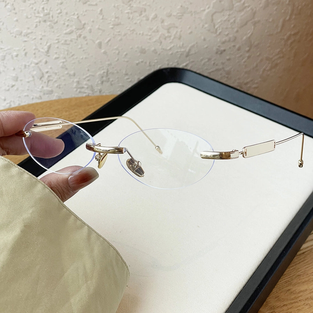 Echo Oval Rimless Glasses Silver Metal Frame With Adjustable Nose Pads